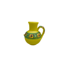 Bright yellow painted clay pot Statue decorated with traditional mirror work
