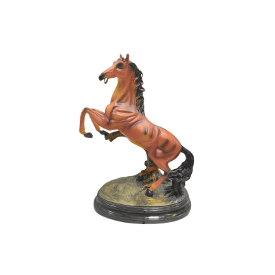 Brown rearing horse Statue on a sculpted rocky base