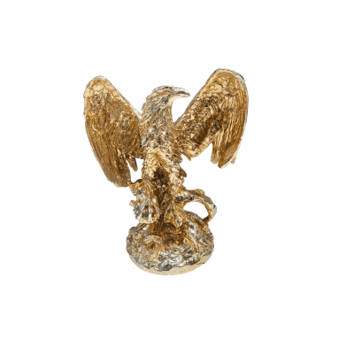 Golden eagle or bird of prey Statue with spread wings perched on a textured base