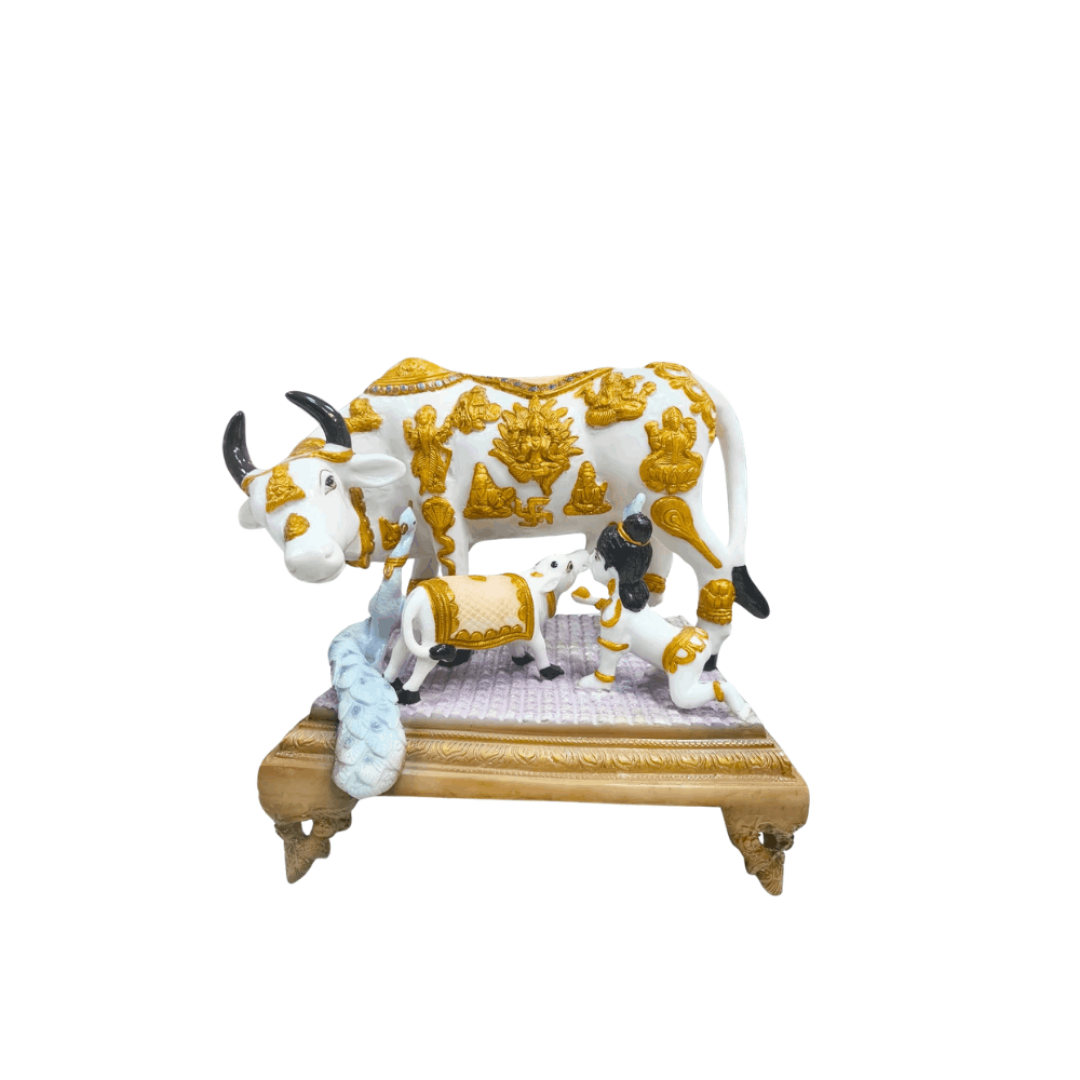 White and gold Kamadhenu cow Statue feeding a calf