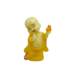Yellow translucent smiling baby monk Statue holding a small gour